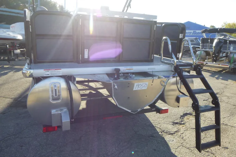 Slide: The Image of 2027 Premier 210 Sunsation Angler 4PT - CL pontoon boat rear view with ladder. - 4