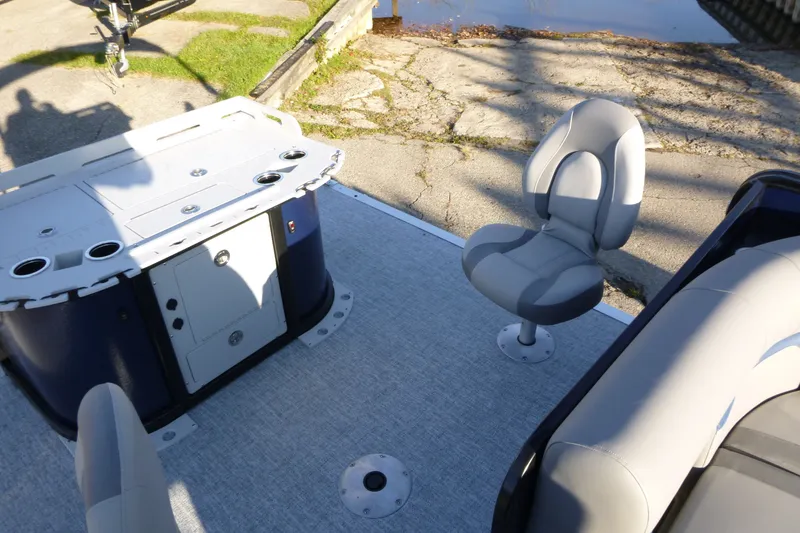 Slide: The Image of 2027 Premier 210 Sunsation Angler 4PT boat interior with seating and storage. - 24