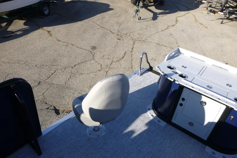 Slide: The Image of 2027 Premier 210 Sunsation Angler 4PT boat interior with seating and storage compartments. - 23