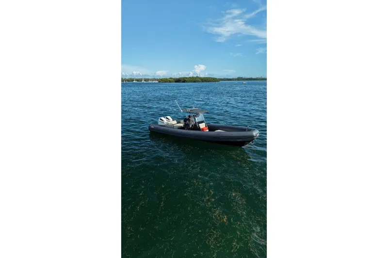 Slide: The Image of 2023 Seawater PHANTOM 280 boat on calm blue water under clear sky. - 23