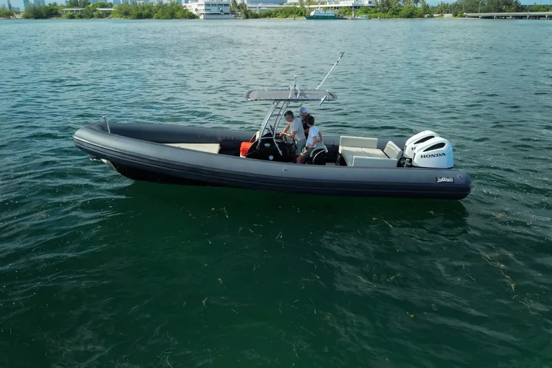 Slide: The Image of 2023 Seawater PHANTOM 280 boat on calm water with Honda engine. - 8