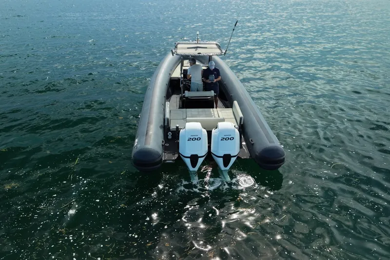 Slide: The Image of Seawater PHANTOM 280 boat with dual engines on calm water, 2023 model. - 9
