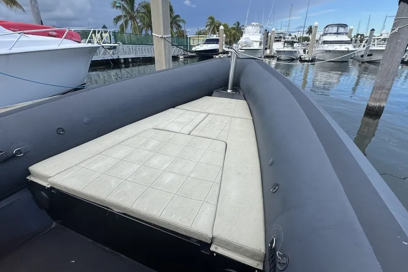 Slide: The Image of 2023 Seawater PHANTOM 280 boat with cushioned deck, docked at marina. - 17