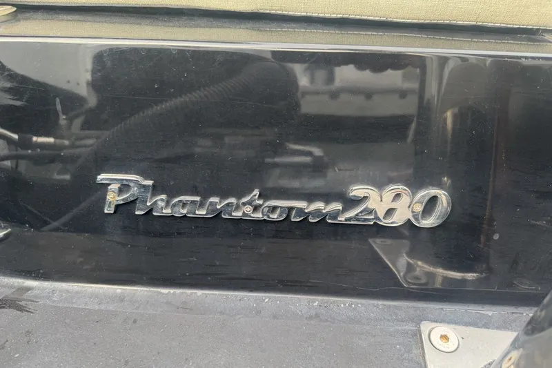 Slide: The Image of Seawater PHANTOM 280 emblem on black surface, 2023 model. - 13