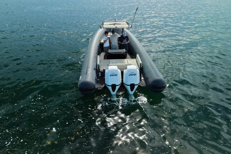 Slide: The Image of 2023 Seawater PHANTOM 280 boat with dual 200 horsepower engines on open water. - 10