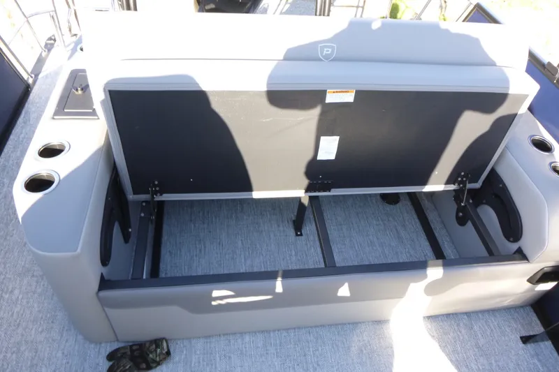 Slide: The Image of Open storage compartment on 2027 Premier 210 Sunsation RL - CL boat seat. - 23