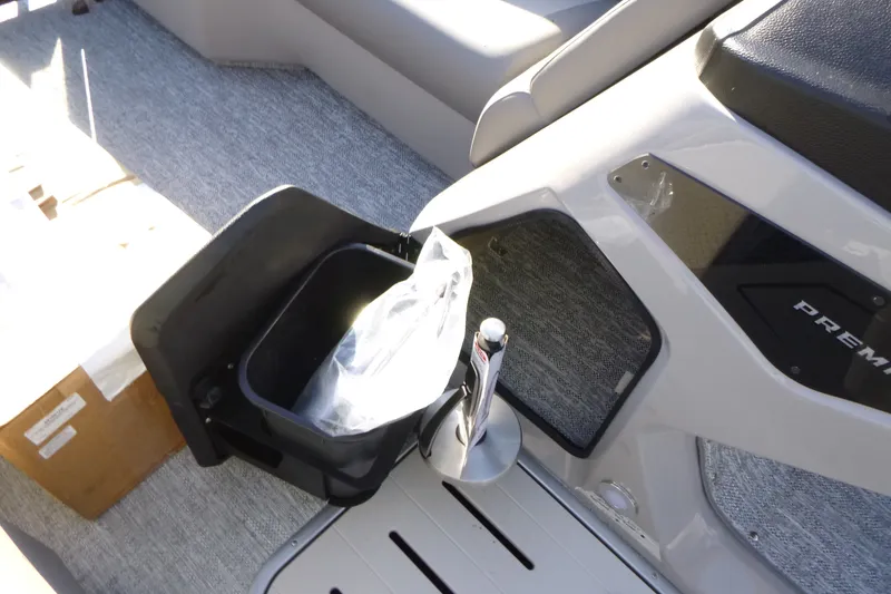 Slide: The Image of Interior of 2027 Premier 210 Sunsation RL - CL boat with storage compartment. - 27