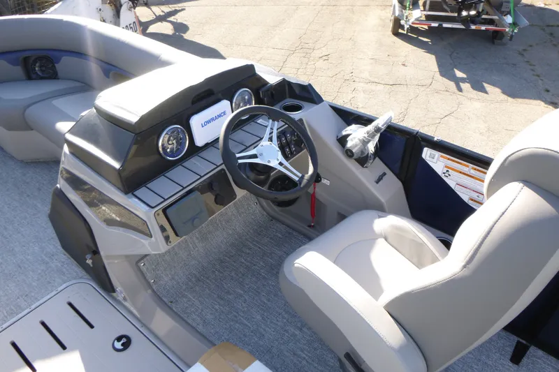 Slide: The Image of 2027 Premier 210 Sunsation RL - CL boat interior with steering wheel and dashboard. - 15