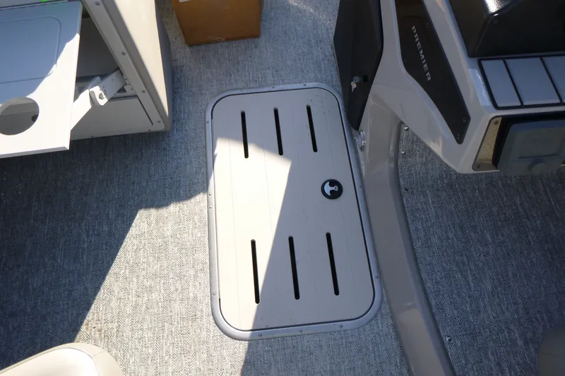 Slide: The Image of Interior view of 2027 Premier 210 Sunsation RL - CL boat, featuring a storage compartment. - 24