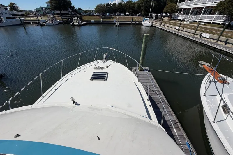 Slide: The Image of 1983 Bertram 38III Convertible yacht docked in a marina, aerial view. - 41