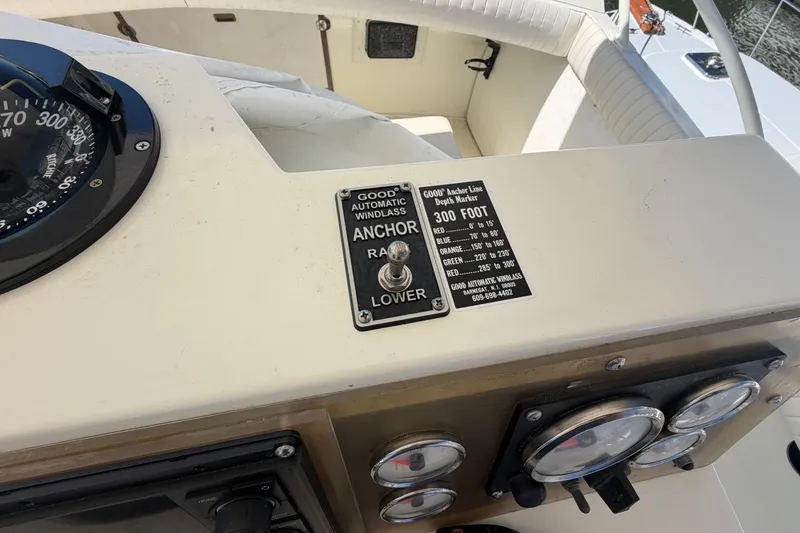 Slide: The Image of Control panel of a 1983 Bertram 38III Convertible boat with anchor controls. - 40