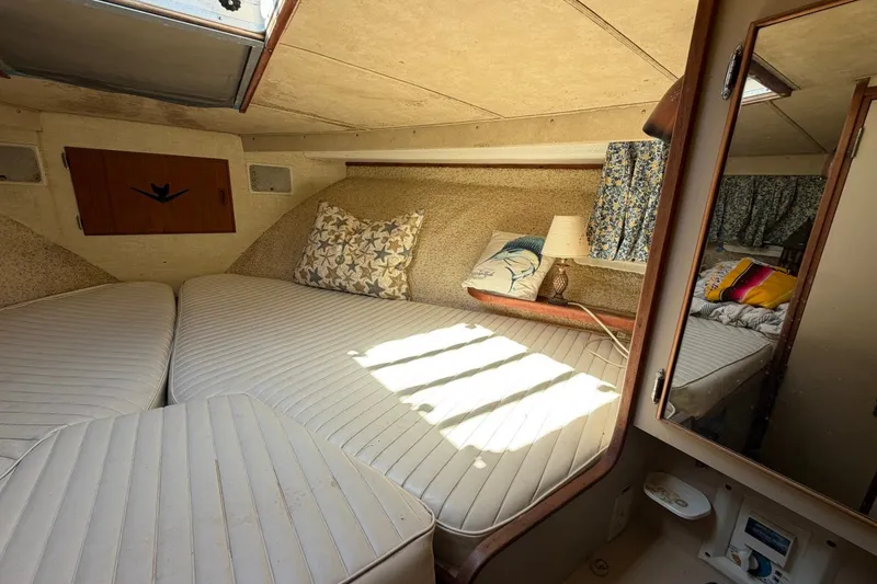 Slide: The Image of Cozy cabin interior of 1983 Bertram 38III Convertible with cushions and decorative pillows. - 21