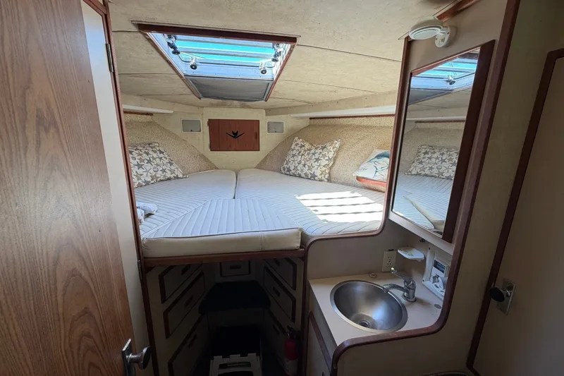 Slide: The Image of Cozy cabin interior of 1983 Bertram 38III Convertible with bed, skylight, and sink. - 15