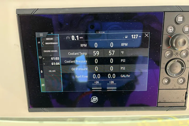 Slide: The Image of Dashboard display of a 2026 Tiara Yachts 34 LS showing engine metrics and controls. - 29