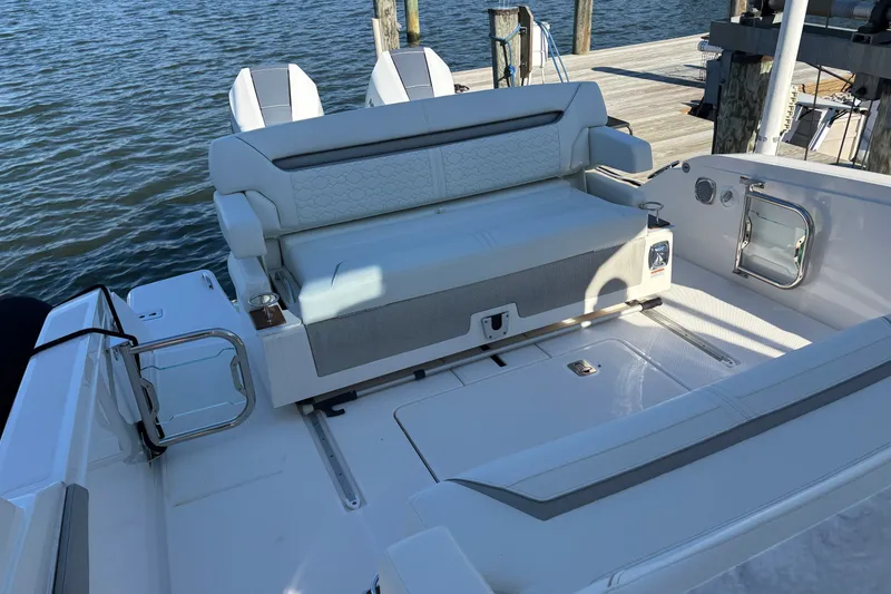 Slide: The Image of 2026 Tiara Yachts 34 LS boat interior with plush seating and water view. - 24