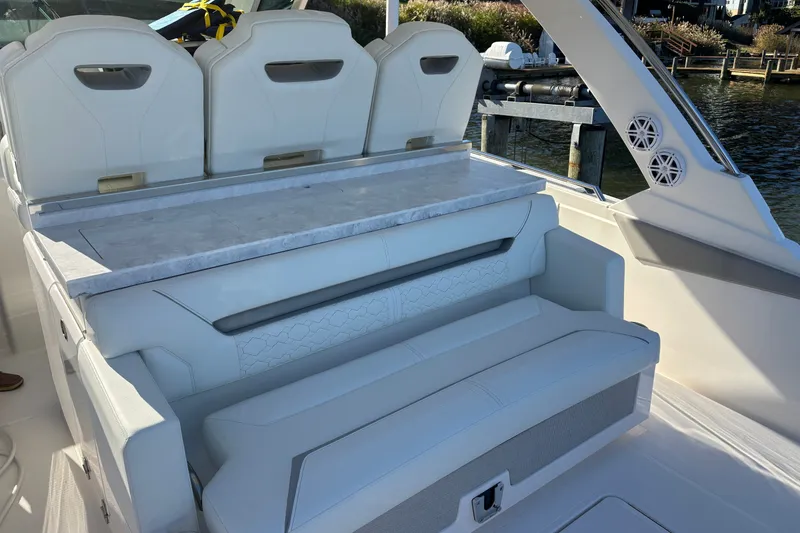 Slide: The Image of 2026 Tiara Yachts 34 LS interior seating with elegant design and waterfront view. - 28