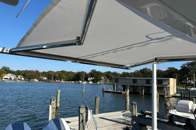 Slide: The Image of 2026 Tiara Yachts 34 LS at dock with scenic waterfront view. - 37