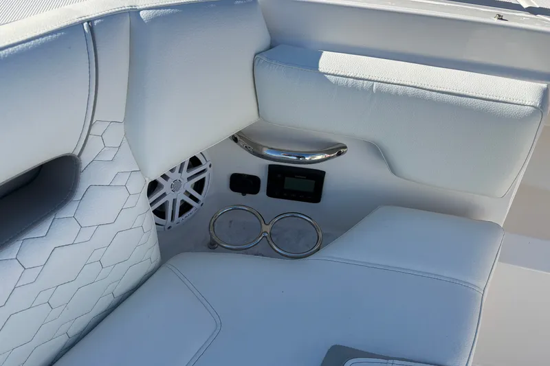 Slide: The Image of Luxurious interior of 2026 Tiara Yachts 34 LS with white seating and speaker system. - 21