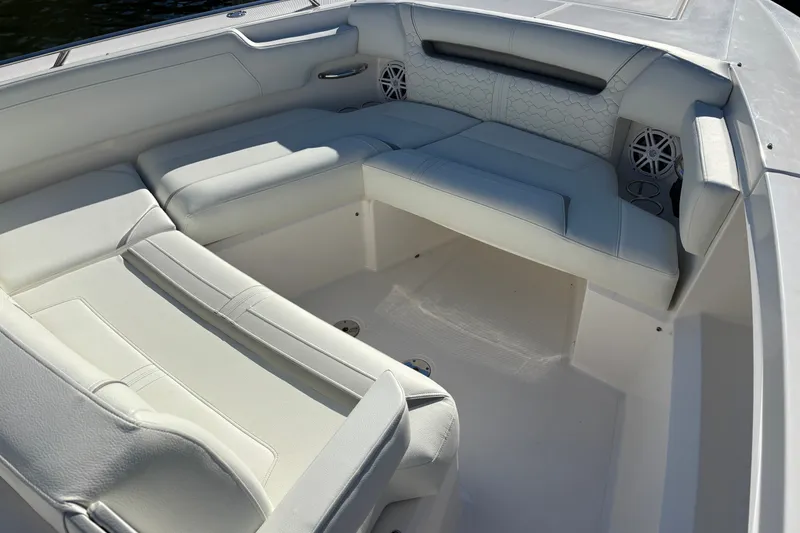 Slide: The Image of Luxurious seating area on 2026 Tiara Yachts 34 LS, featuring elegant white upholstery. - 20
