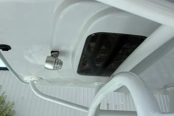 Slide: The Image of 2024 Exuma 22 boat detail showing underside structure and mounted light. - 26