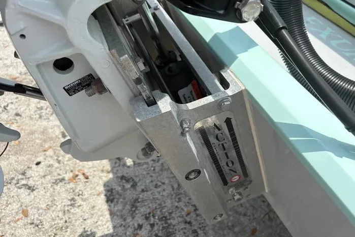Slide: The Image of Close-up of 2024 Exuma 22 boat motor mount with visible adjustment mechanism. - 29