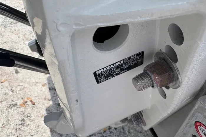 Slide: The Image of Close-up of a Suzuki outboard motor part on a 2024 Exuma 22 boat. - 30