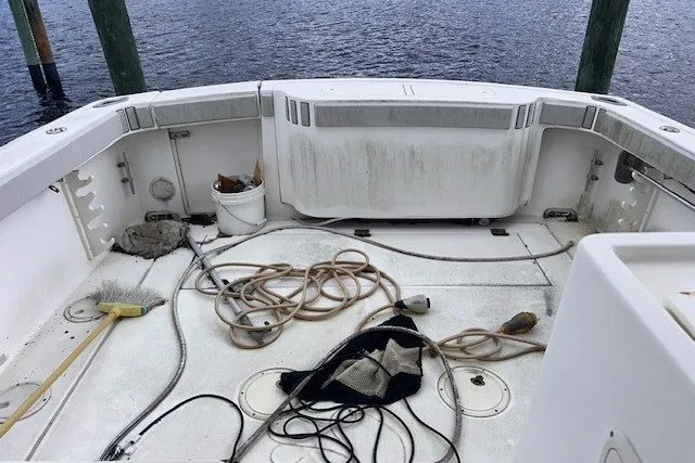 Slide: The Image of Cockpit of 2000 Shamrock 290 Walkaround boat with ropes and cleaning tools. - 17