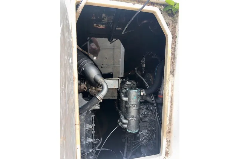 Slide: The Image of Engine compartment of a 2000 Shamrock 290 Walkaround boat, showing mechanical components. - 7