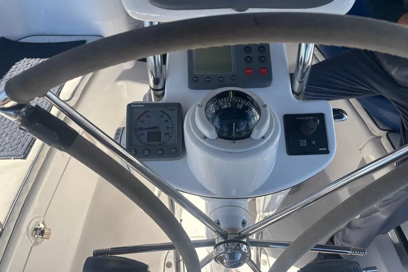 Slide: The Image of Helm of 2008 Hunter 41 Deck Salon with navigation instruments and compass. - 3