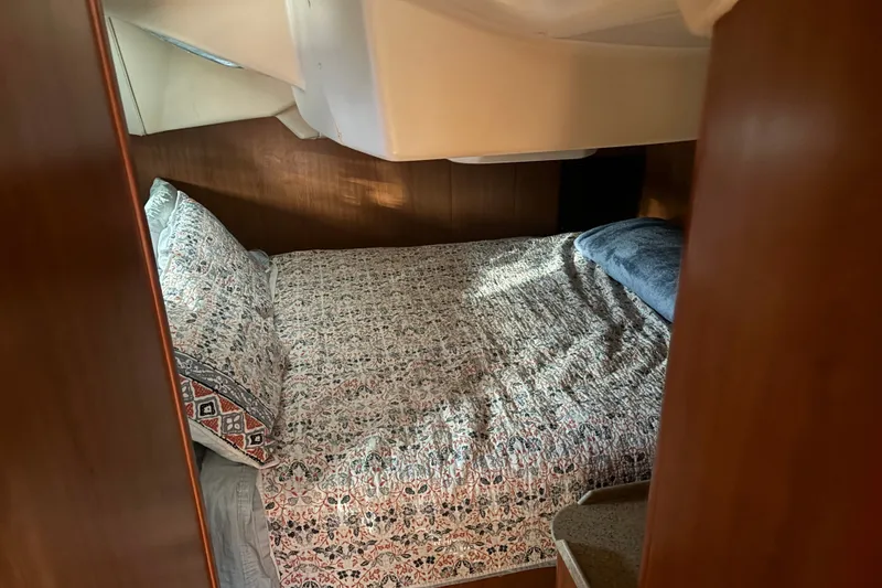 Slide: The Image of Cozy cabin interior of 2008 Hunter 41 Deck Salon with patterned bedding. - 15