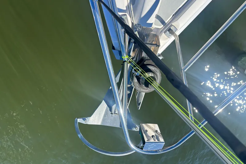 Slide: The Image of Bow view of 2008 Hunter 41 Deck Salon sailboat with green lines and water reflection. - 29