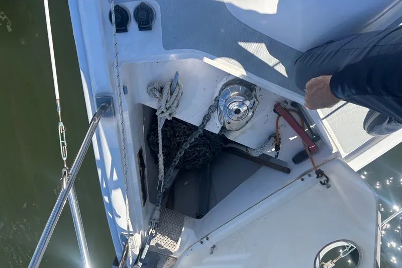 Slide: The Image of Anchor locker of 2008 Hunter 41 Deck Salon sailboat with ropes and winch. - 30