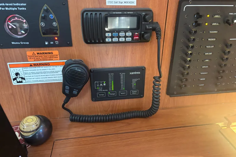Slide: The Image of Control panel of a 2008 Hunter 41 Deck Salon with radio and electrical switches. - 22