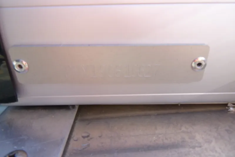 Slide: The Image of Close-up of a metal plate on a 2027 Premier 230 Sunsation Angler 2PT - CL boat. - 34