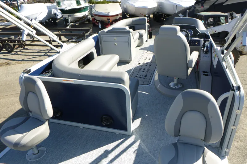 Slide: The Image of 2027 Premier 230 Sunsation Angler 2PT - CL pontoon boat interior with seating and console. - 33