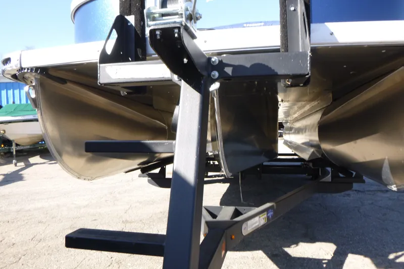 Slide: The Image of 2027 Premier 230 Sunsation Angler 2PT - CL pontoon boat on trailer, close-up view. - 13