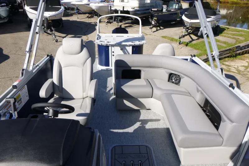 Slide: The Image of 2027 Premier 230 Sunsation Angler 2PT - CL pontoon boat interior with seating and steering console. - 25