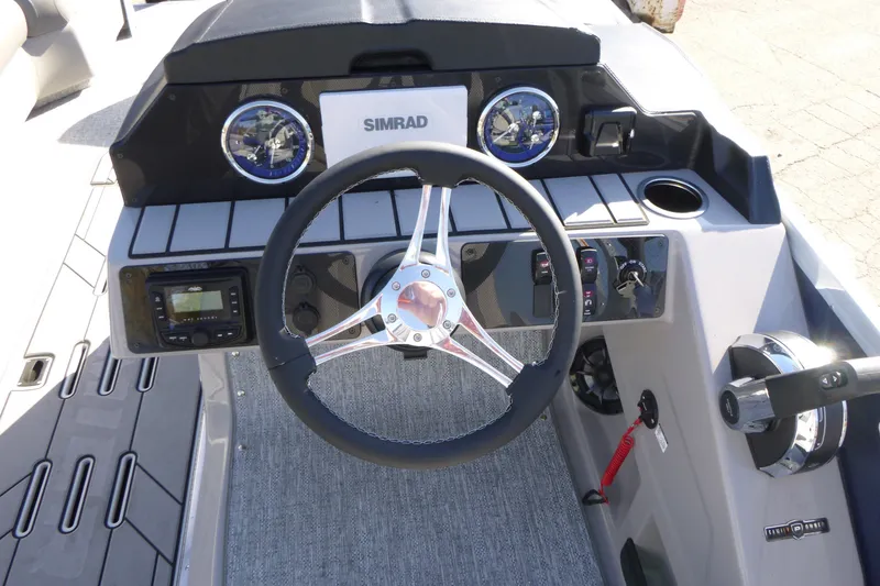 Slide: The Image of Steering console of 2027 Premier 230 Sunsation Angler 2PT - CL with Simrad display. - 27