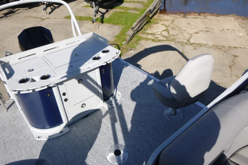 Slide: The Image of 2027 Premier 230 Sunsation Angler 2PT - CL boat interior with seating and storage. - 32