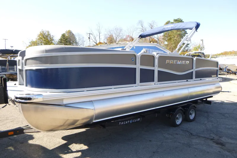 Slide: The Image of 2027 Premier 230 Sunsation Angler 2PT - CL pontoon boat on trailer, side view. - 8