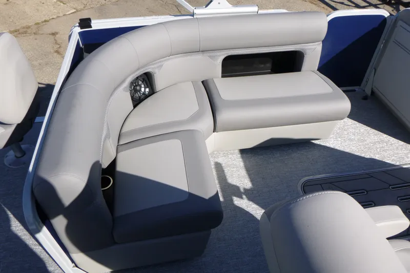 Slide: The Image of Premier 230 Sunsation Angler 2PT - CL 2027 boat interior with gray seating and speaker. - 28