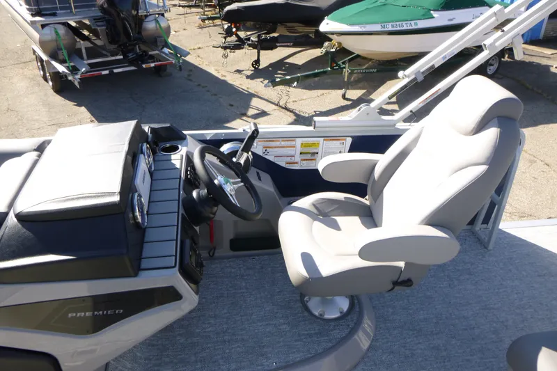 Slide: The Image of Premier 230 Sunsation Angler 2PT - CL 2027 boat helm with comfortable captain's chair. - 26