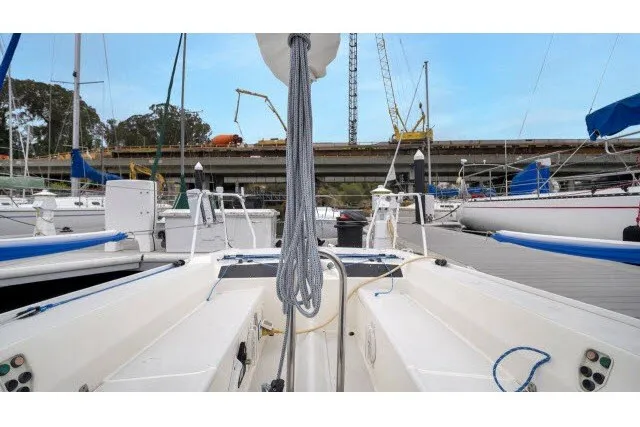 Slide: The Image of 2005 J Boats J/100 sailboat docked at marina, view of cockpit and rigging. - 8