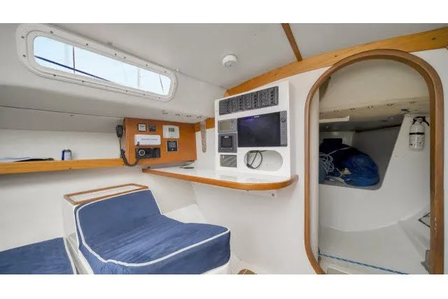 Slide: The Image of Interior of 2005 J Boats J/100 sailboat with navigation equipment and seating area. - 18