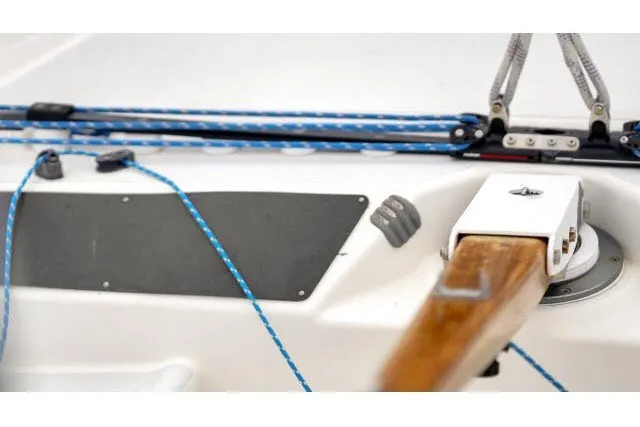 Slide: The Image of Close-up of 2005 J Boats J/100 sailboat deck with ropes and wooden tiller. - 13