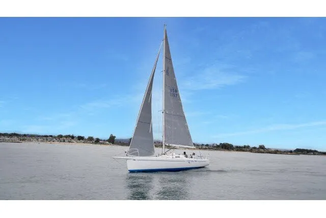 Slide: The Image of Sailing yacht J Boats J/100 2005 on calm waters under a clear blue sky. - 41