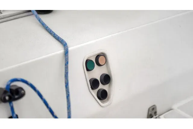 Slide: The Image of Control panel on 2005 J Boats J/100 sailboat with blue rope detail. - 9
