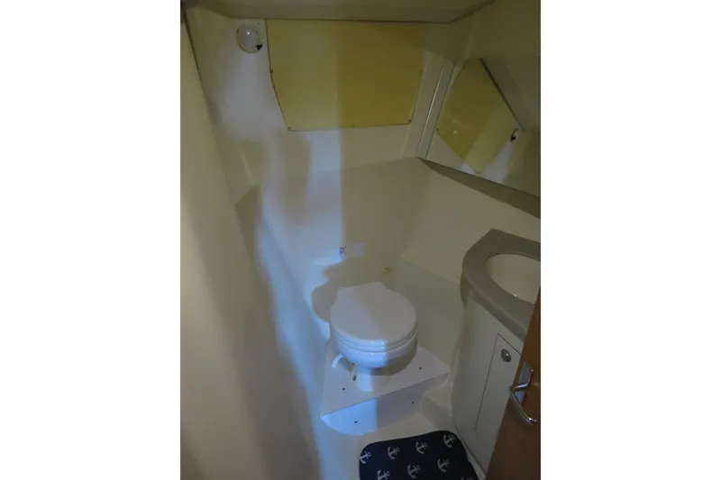 Slide: The Image of Compact bathroom in 2000 Hunter Legend 410 sailboat with toilet and sink. - 17