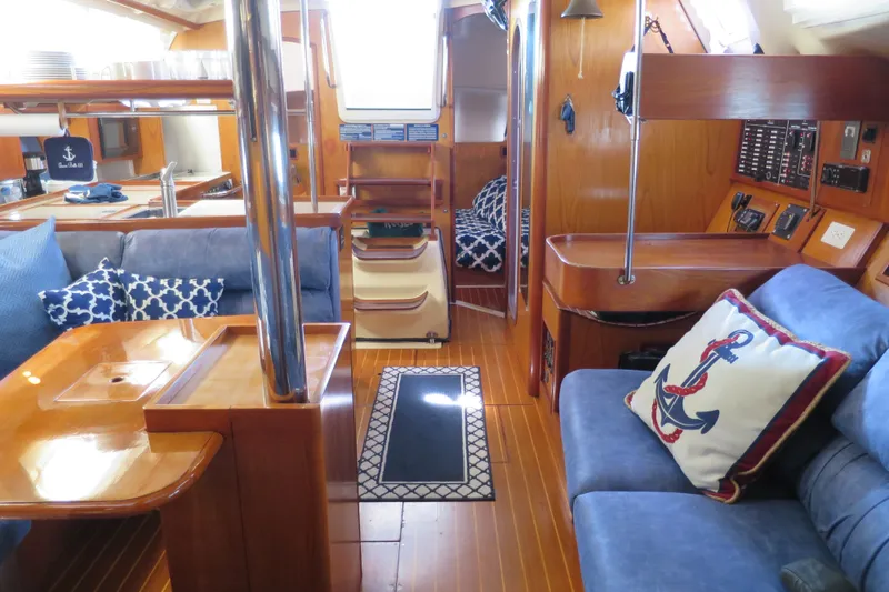 Slide: The Image of Interior of 2000 Hunter Legend 410 yacht with cozy seating and nautical decor. - 20