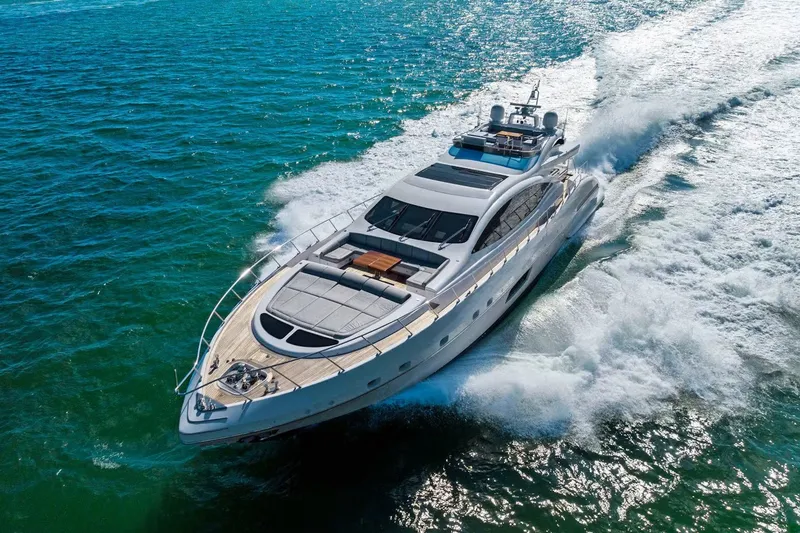 Slide: The Image of Luxurious 2016 Mangusta 94 yacht cruising swiftly on open blue waters. - 4